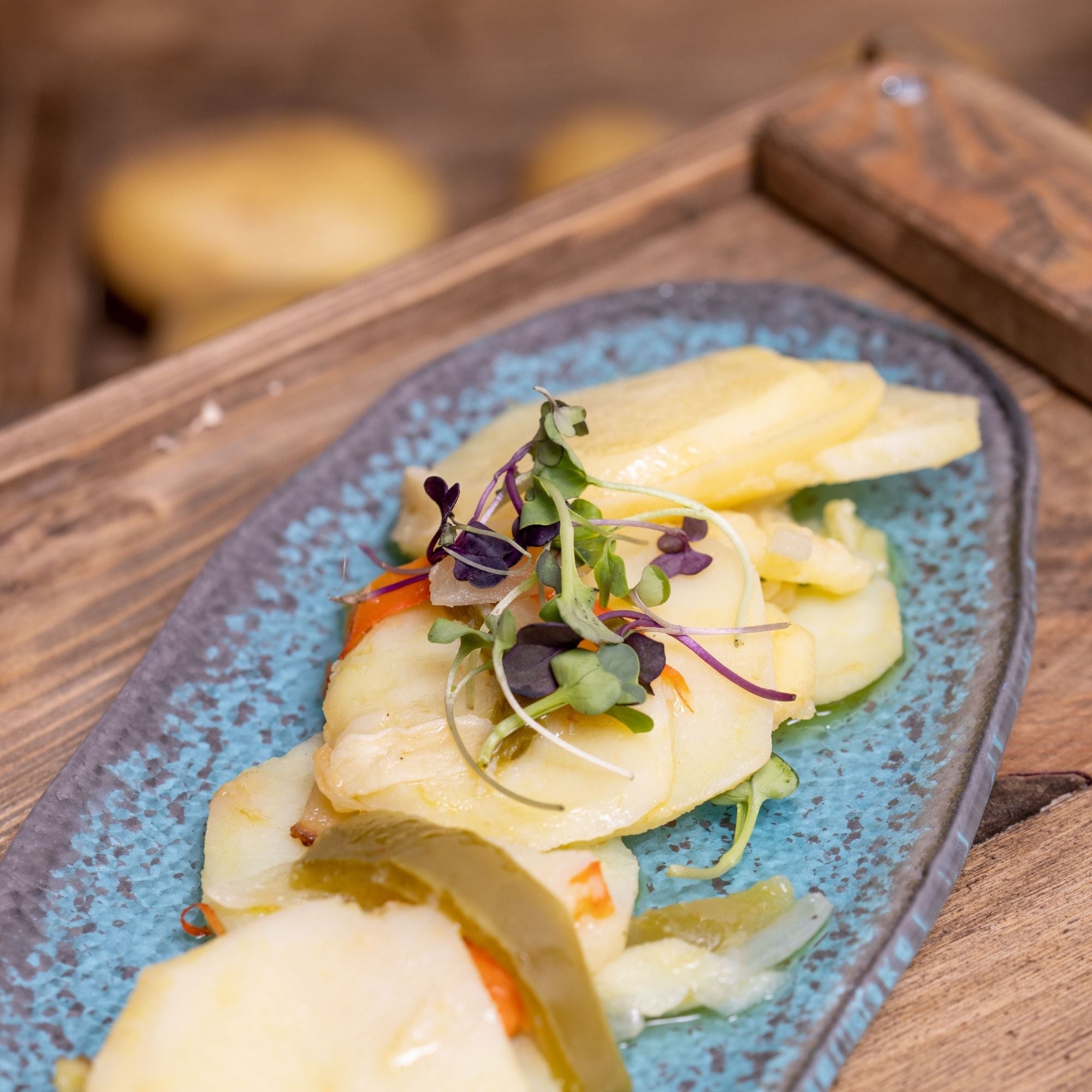 Patatas panaderas con pimiento y cebolla