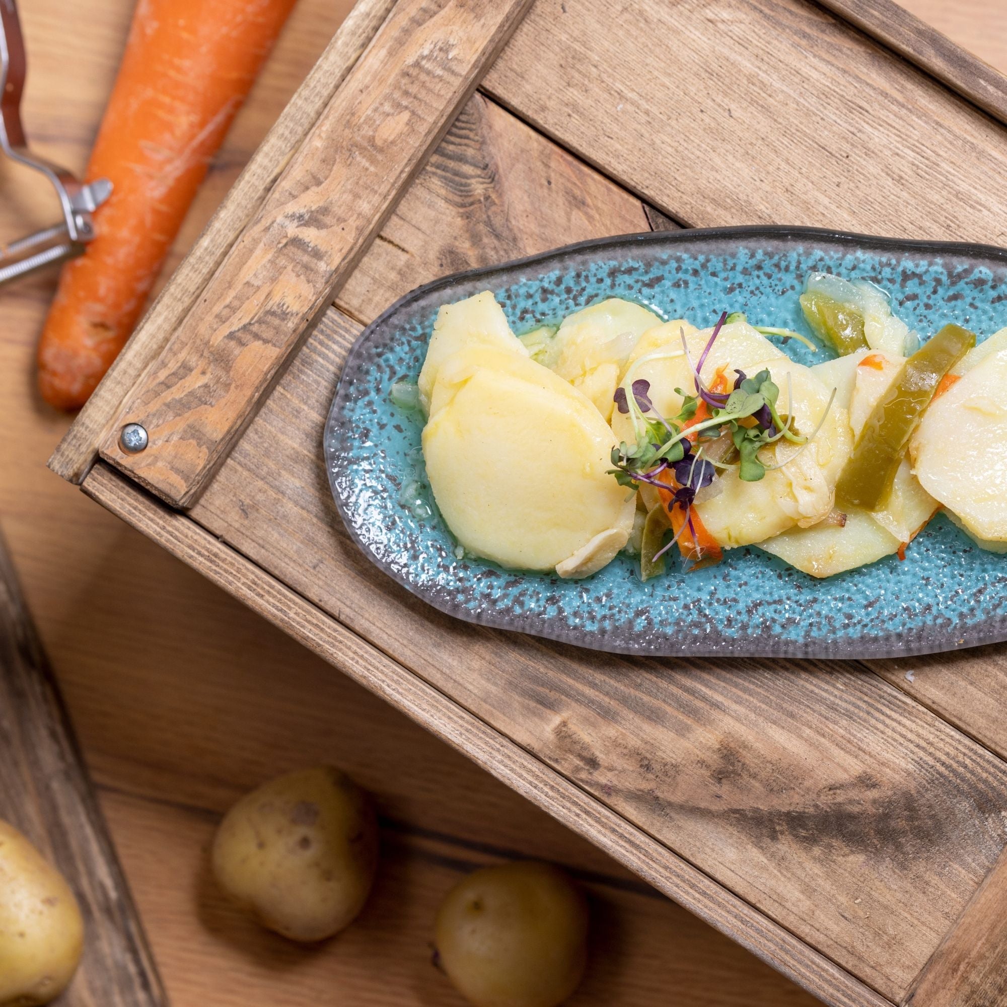 Patatas panaderas con pimiento y cebolla
